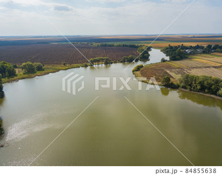 Aerial View Above Large Lake Near Agricultural Fields 84855638