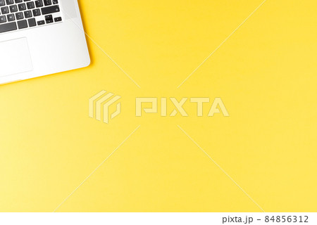 Elegant laptop on yellow table. Office desktop Elegant laptop on yellow table. Office desktop 84856312