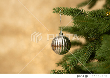 Closeup of Christmas balls on christmas tree. New Year concept. Closeup of Christmas balls on christmas tree. New Year concept. 84869726