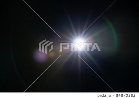 Sun flare on the black background 84870382