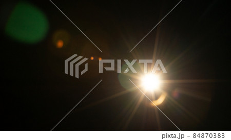Sun flare on the black background 84870383