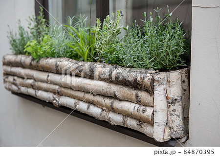 Wooden flower pot on the street of Riga. Latvia 84870395