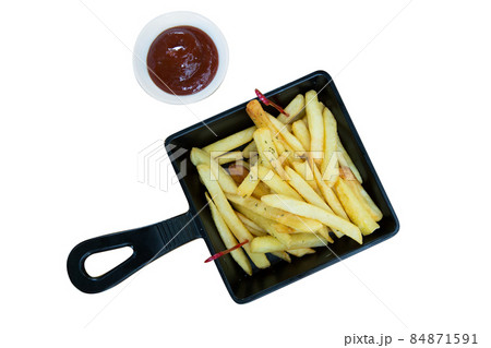 French fried in black plate with tomato sauce 84871591