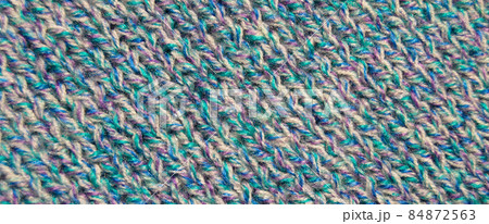 Handmade knitted fabric colored wool background texture 84872563