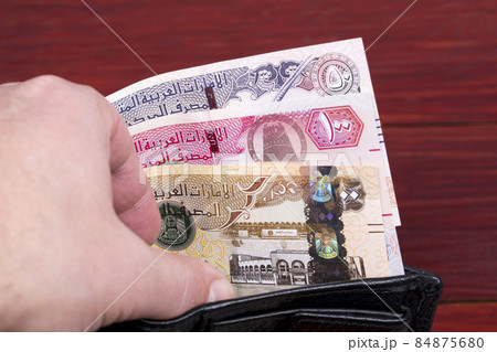 United Arab Emirates money in the black wallet United Arab Emirates money in the black wallet 84875680