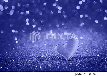 Cute red heart for valentine's day on bokeh background. Trendy color of the year 2022. Greeting card, place for text. Cute red heart for valentine's day on bokeh background. Trendy color of the year 2022. Greeting card, place for text. 84876800
