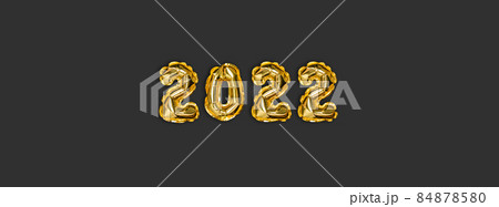 2022 golden foil balloons decor and Christmas snow with copy space on dark background. New Year concept 84878580