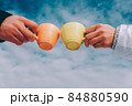 Two cups of coffee in the hands of in love couple. winter theme 84880590