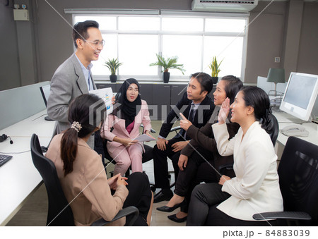 Young businessman present graph report and statistics of profit with finance. Young businessman present graph report and statistics of profit with finance. 84883039