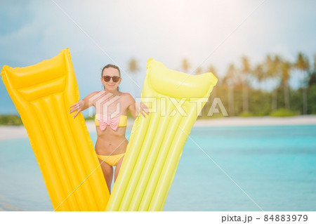 Young happy woman relaxing on the beach 84883979
