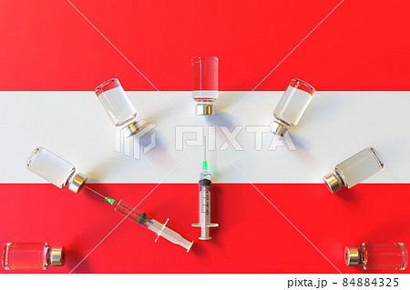 Syringes and medical vials on the flag of Austria. Vaccination related conceptual 3D rendering 84884325