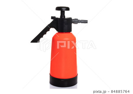 orange garden hand sprayer on white isolated background 84885764