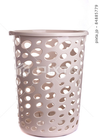 beige plastic empty basket for dirty laundry on white isolated background beige plastic empty basket for dirty laundry on white isolated background 84885779