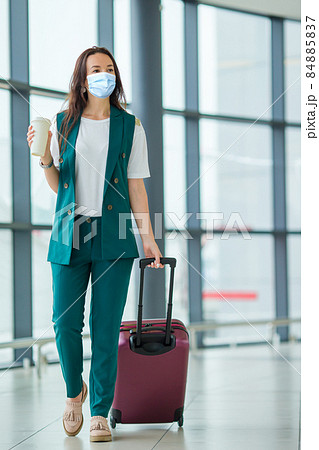 Young tourist woman with baggage in international airport 84885837