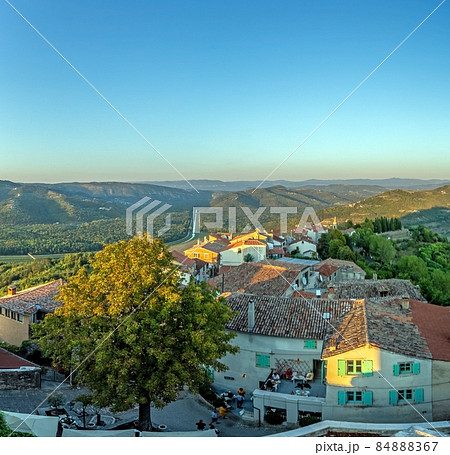 Panoramic view from the city wall of Motovun over the surrounding countryside during the day Panoramic view from the city wall of Motovun over the surrounding countryside during the day 84888367