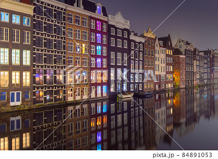 Famous dancing houses on the Amsterdam city waterfront at dawn. Famous dancing houses on the Amsterdam city waterfront at dawn. 84891053