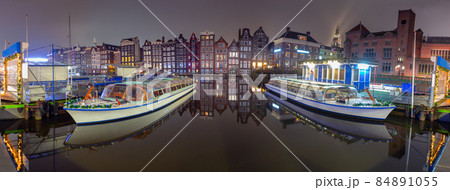 Famous dancing houses on the Amsterdam city waterfront at dawn. Famous dancing houses on the Amsterdam city waterfront at dawn. 84891055