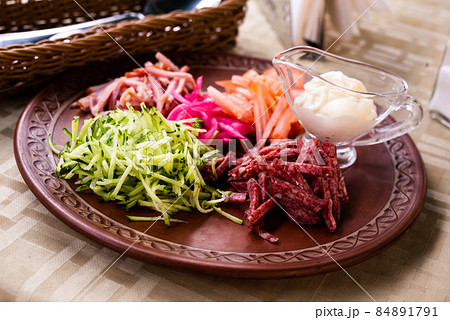 traditional Belarusian salad of vegetables and bacon. salad Paparats kvetka 84891791