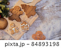 Xmas cookie for Christmas and Happy New Year. Gingerbread with decoration at home. 84893198