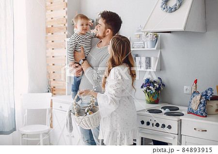 Family with little son in a kitchen Family with little son in a kitchen 84893915