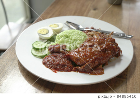 Nasi Lemak coconut rice with spicy fried chicken aka ayam merah 84895410
