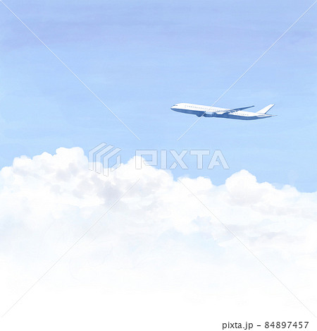 澄んだ青空と雲の上を飛ぶ飛行機 84897457