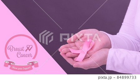 Woman with breast cancer awareness slogan and ribbon against purple background, copy space 84899733