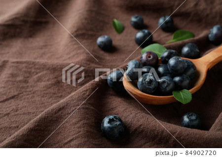 Fresh berry concept with blueberry on kitchen towel background Fresh berry concept with blueberry on kitchen towel background 84902720