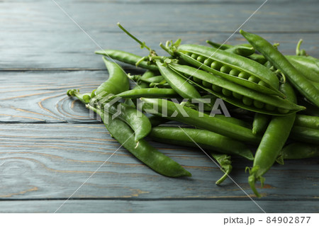 Fresh green pea on gray wooden table Fresh green pea on gray wooden table 84902877