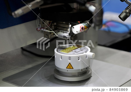 close up of semi-automatic ultrasonic wire bonder 84903869