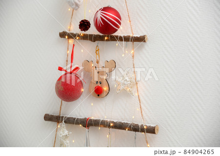 Handmade wooden Christmas tree hanging on the wall 84904265