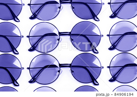 Color of year 2022.Very Peri. Violet style glasses isolated on white background Color of year 2022.Very Peri. Violet style glasses isolated on white background 84906194