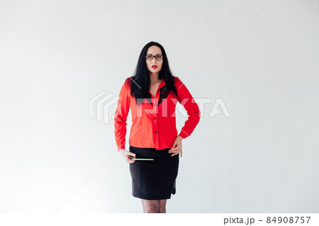 beautiful brunette woman in business clothes in a white office beautiful brunette woman in business clothes in a white office 84908757