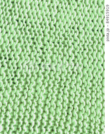 Green cozy sweater knitted made of natural wool texture Green cozy sweater knitted made of natural wool texture 84915919