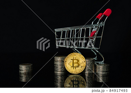 Bitcoin coin in shopping cart with black background 84917493