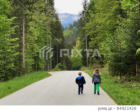 Teenage girl and small boy at Engalm Valley in Karwendel mountains in Austria Teenage girl and small boy at Engalm Valley in Karwendel mountains in Austria 84921426