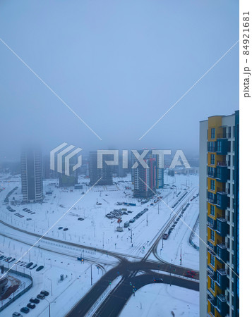 Winter cityscape. Multi-storey buildings under construction. Construction concept Winter cityscape. Multi-storey buildings under construction. Construction concept 84921681