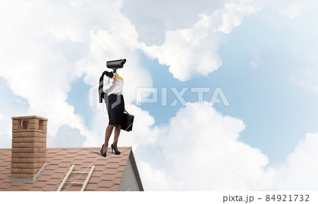 Concept of security and privacy protection with camera headed woman Concept of security and privacy protection with camera headed woman 84921732