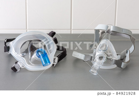 Two types of non-invasive ventilation face mask, close up view, in ICU in hospital. 84921928