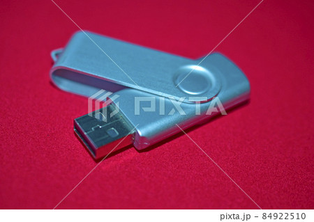 USB flash drive on a red velvet background USB flash drive on a red velvet background 84922510