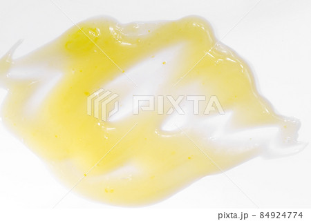 Liquid swatch care cosmetics on a white surface 84924774