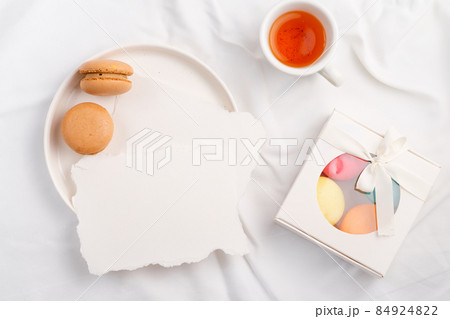 Plate with Mockup paper blank and macarons on textile background Plate with Mockup paper blank and macarons on textile background 84924822
