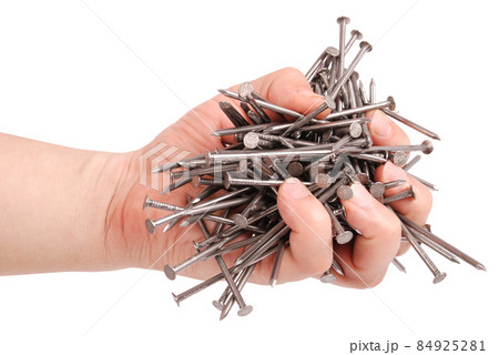 Man's hand holding metal nails (Clipping path) Man's hand holding metal nails (Clipping path) 84925281
