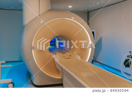 Medical CT or MRI Scan in the modern hospital laboratory. Interior of radiography department. Technologically advanced equipment in white room. Magnetic resonance diagnostics machine. Medical CT or MRI Scan in the modern hospital laboratory. Interior of radiography department. Technologically advanced equipment in white room. Magnetic resonance diagnostics machine. 84930594