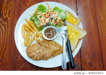 Steak with salad and bread, Top view Steak with salad and bread, Top view 84932852