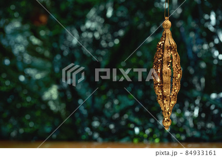 Christmas ornaments glass baubles on green bokeh background 84933161