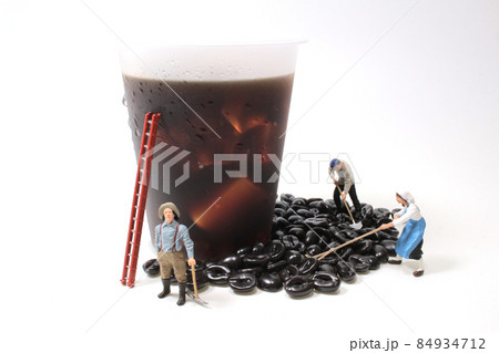 A Figures working on coffee, Coffee Beans On Table 84934712