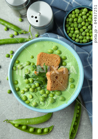Concept of tasty eating with pea soup on white background Concept of tasty eating with pea soup on white background 84937251