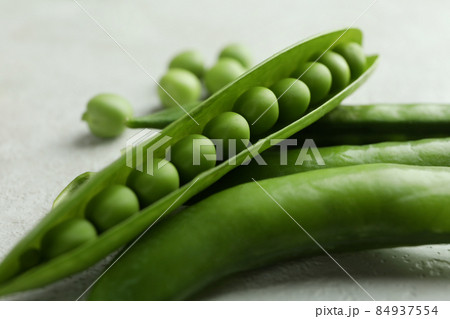 Fresh green pea on white textured background 84937554