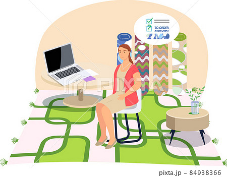 Woman works at table with computer in room interior with geometric pattern rug and rolled carpets 84938366